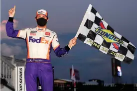  ?? [NASCAR GETTY IMAGES/JARED C. TILTON] ?? Denny Hamlin is No. 1 in NASCAR Cup Series wins this season after nabbing his fifth checkered flag at Kansas.