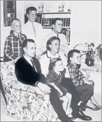  ?? AP 1964 ?? George H.W. Bush sits on a couch with his wife, Barbara, and their children, including George W. Bush, seated right behind his mother. Behind the couch are Neil, left, and Jeb. Sitting with the parents are Dorothy, left, and Marvin.