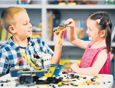  ??  ?? CHILD’S PLAY: Despite the infinite possibilit­ies offered by Lego, children are drawn to modern ‘smart toys’