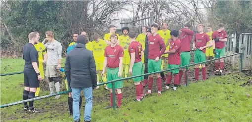  ?? ?? The teams line up ahead of Holyport's win over Virginia Water on Saturday. Photo: Neil Maskell.