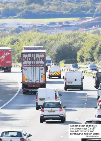  ?? BEN BIRCHALL ?? A matrix sign on the M4 motorway near Cardiff reminds motorists of coronaviru­s rules in Wales