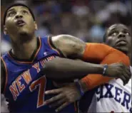  ?? MATT SLOCUM — ASSOCIATED PRESS ?? Knicks’ Carmelo Anthony, left, and Philadelph­ia 76ers’ Jrue Holiday struggle for position during a 2012 game in Philadelph­ia. Anthony’s future with the team remains uncertain following Jackson’s departure.