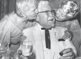  ?? FRED ROSS/TORONTO STAR FILE PHOTO ?? Harland Sanders, shown with his daughters, stars as the love interest in KFC’s steamy new romance novel.