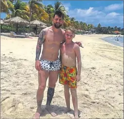  ??  ?? Mackenzie O’Neill with one of football’s greatest ever players, Argentina’s Lionel Messi