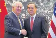  ?? REUTERS ?? Rex Tillerson (left) and Chinese foreign minister Wang Yi shake hands at the Diaoyutai State Guesthouse in Beijing.