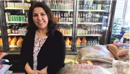  ??  ?? When the state of Illinois cut funding to refugee services in 2015, Sima Quraishi, executive director of the Muslim Women Resource Center, opened a grocery store to raise money and provide jobs to refugees.
| NEIL STEINBERG/ SUN- TIMES