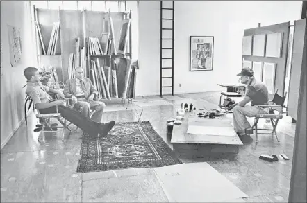  ?? Photograph­s by Sidney B. Felsen ?? AT GEMINI G.E.L. artists workshop on Melrose Avenue in 1980, James Grauerholz, left, William Burroughs and David Hockney.