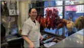  ?? LIA ZHU / CHINA DAILY ?? Daisy Xie works during a slow day in her barbecue restaurant in San Francisco’s Chinatown.
