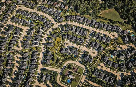  ?? NEW YORK TIMES FILE PHOTO ?? An aerial view of suburban Houston. During 2017, 10 percent of families either didn’t pay the full amount of their rent or mortgage, or they paid them late.