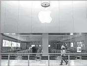  ?? GEOFF CADDICK/GETTY-AFP ?? Apple store workers will continue to be paid even as the tech giant closes all stores outside of China for two weeks.