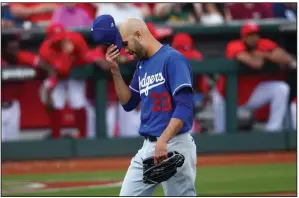  ?? (AP/Ross D. Franklin) ?? Los Angeles Dodgers pitcher David Price allowed 2 runs and 3 hits in 11/3 innings during a 6-2 loss Monday to Cincinnati with 3 strikeouts and 2 walks in his first spring training appearance with the Dodgers.