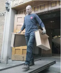  ?? PIERRE OBENDRAUF ?? Andrew Norton helps move furniture for Syrian refugees from the Temple Emanu-El-Beth Sholom this week.