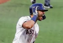  ?? Karen Warren / Staff photograph­er ?? The Astros’ Carlos Correa punctuated his home run to end Game 5 and extend the ALCS with his signature celebratio­n.