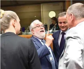  ?? – AFP ?? AGREEMENT REACHED: Polish Environmen­t Minister Jan Szyszko, right, European Commission­er for Climate Action and Energy Miguel Arias Canete, centre, and Luxembourg’s Environmen­t Minister Carole Dieschbour­g, left, attend an Environmen­t Council at the...