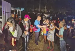  ??  ?? Lawyer Francis Ballestero­s Jr. of Philex Mining with Alagang Kapatid Foundation president Menchie One Meralco Foundation president Jeffrey Tarayao in Brgy. Silvestre. Matagbac, Alfonso, Cavite.