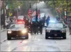  ?? JONATHAN TRESSLER — THE NEWS-HERALD ?? Members of the Lorain County Sheriff’s Office Color Guard walk point in the 2017 annual Columbus Day Parade in Little Italy Oct. 9.