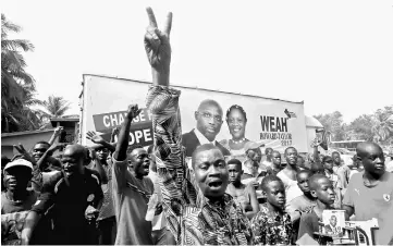  ??  ?? Supporters of Weah, celebrate after the announceme­nt of the presidenti­al election results in Monrovia, Liberia. — Reuters photo