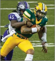  ?? (AP/Bruce Kluckhohn) ?? Central Arkansas linebacker Dre Matthews ( left) tackles North Dakota State quarterbac­k Trey Lance during an Oct. 3 matchup in Fargo, N.D. The Bears have forced 11 turnovers and recorded 13 sacks heading into today’s game against Arkansas State in Jonesboro.