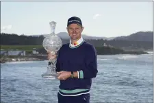  ?? GODOFREDO A. VÁSQUEZ — THE ASSOCIATED PRESS ?? Justin Rose, of England, poses for a photograph with the trophy after winning the AT&T Pebble Beach Pro-Am golf tournament in Pebble Beach, Calif., Monday, Feb. 6, 2023.