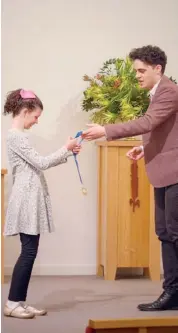  ?? Photograph: Josiah Gillan ?? Kate McGann receives a prize in the woodwind section of the eisteddfod from adjudicato­r Luke Carbon.