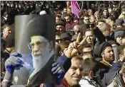  ?? IRAN PRESS ?? A video provided by Iran Press, a pro-government agency based in Beirut, shows pro-government demonstrat­ors Wednesday in Arak, Iran. State TV called the rallies an “answer to (anti-government) protests.”