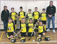  ??  ?? Rosie Flannigan, left, presented the new kits to the young Inverlochy shinty stars last week.