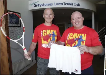  ??  ?? Chris with John Glynn from the Gavin Glynn Foundation and the famous skirt, which will be auctioned off to raise money for the foundation.