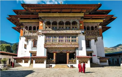  ?? Alexandra Reynolds via AP ?? aboveGangt­ey Gonpa, or monastery, in the upper Thimphu Valley in Western Bhutan. The 450-year old monastery is built like a fortress with a central tower enclosing temples and exterior walls that house monks’ cells. The Gangtey Gonpa was prophesize­d by 15th century religious leader Pema Lingpa, from whom today’s royal family descends.