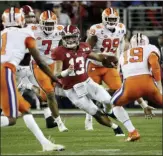  ?? DAVID J. PHILLIP — THE ASSOCIATED PRESS FILE ?? Alabama QB Tua Tagovailoa was humbled during the national championsh­ip loss to Clemson last season.