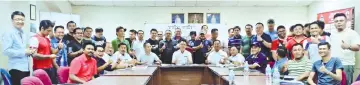  ??  ?? Officials and representa­tives take one for the album at the managers' meeting at the Likas Stadium, yesterday.