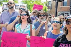  ?? AP PHOTO ?? People attend the LGBTQ Chicago Equality rally in the Andersonvi­lle neighbourh­ood of Chicago. Starting in January, Illinois is outlawing a rare criminal defence argument allowing the use of a victim’s sexual orientatio­n as justificat­ion for violent...