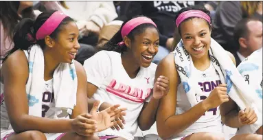  ?? Jessica Hill / Associated Press ?? From left, UConn’s Megan Walker, Crystal Dangerfiel­d and Napheesa Collier look on from the bench during the second half on Saturday.