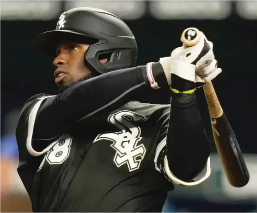  ?? ORLIN WAGNER/AP ?? Sox rookie Luis Robert belts a three-run homer Thursday night in Kansas City — a 458-foot bomb that left even his fellow big hitters in the dugout in awe.