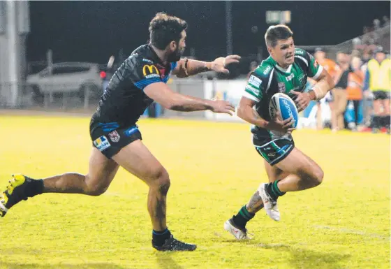  ?? RUNNING RAMPANT: Townsville Blackhawks fullback Carlin Anderson takes on the Cutters’ defence during Saturday night’s game in Mackay. Picture: DANIEL MCKENZIE ??