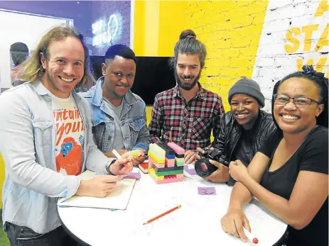  ?? /Lesley Stones ?? Sought-after skills: Umuzi Academy co-director Andrew Levy, student Thorne Ndlovu, academy’s co-director Gilbert Pooley, and students Mo Matli and Bukelwa Moerane with some of the tools of the trades taught at the training centre. Umuzi says it equips...