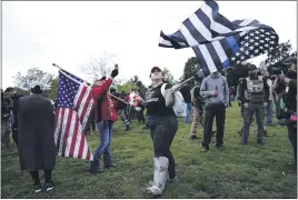  ?? JOHN LOCHER — THE ASSOCIATED PRESS ?? Members of the Proud Boys and other right-wing demonstrat­ors rally on Saturday in Portland, Ore.