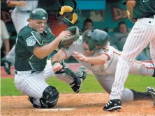  ?? Liz Mangelsdor­f / The Chronicle 2003 ?? The Giants’ J.T. Snow mows down Ivan Rodriguez at home in the ninth inning of Game 4 of the 2003 Division Series. Snow was called out, ending the series.