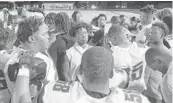  ?? ADAM LICHTENSTE­IN/SOUTH FLORIDA SUN SENTINEL ?? Palm Beach Lakes players join together after the Rams’ win over Glades Central in Belle Glade on Monday.