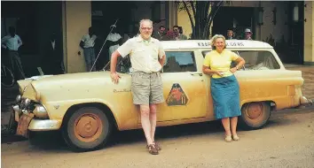  ?? COURTESY SCOTT HALDEMAN ?? Joshua Haldeman with his wife, Winnifred, and the vehicle they used to compete in the Cape to Algiers motor rally in Africa, in which they tied for first place.