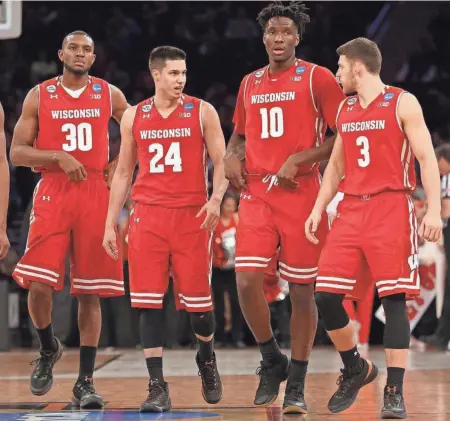  ?? / USA TODAY SPORTS ?? Wisconsin seniors Vitto Brown (from left), Bronson Koenig, Nigel Hayes and Zak Showalter are moving on after losing in the Sweet 16.