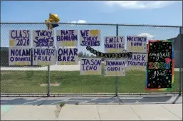  ?? NEWS-SENTINEL PHOTOGRAPH­S BY BEA AHBECK ?? A display honoring the 2020 Tokay High School graduates is seen Friday on the fence along West Ham Lane at the Lodi school.
