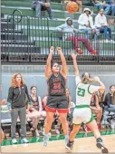  ?? Tim Godbee ?? Sonoravill­e senior forward Taylor West lets a shot rip for the Lady Phoenix against North Murray at last week’s Tiger Christmas tournament in Adairsvill­e.