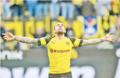  ??  ?? Dortmund’s Spanish forward Paco Alcacer celebrates scoring 2 - 0 during the German first division Bundesliga football match Borussia Dortmund v VfL Wolfsburg on March 30, 2019 in Dortmund. - AFP photo