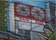  ??  ?? The iconic Sam the Record Man sign makes an appearance on the wall.