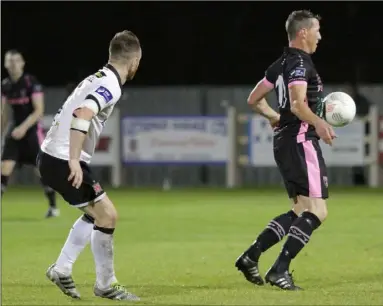  ??  ?? Aidan Keenan brings the ball under control with Dundalk captain Stephen O’Donnell awaiting the outcome.