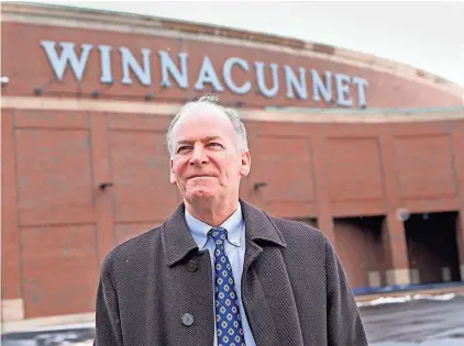  ?? DEB CRAM/STAFF ?? Hampton Town Moderator Bob Casassa poses in front of the Winnacunne­t High School, where he has overseen elections for two decades. Casassa will retire after the March Town Meeting.