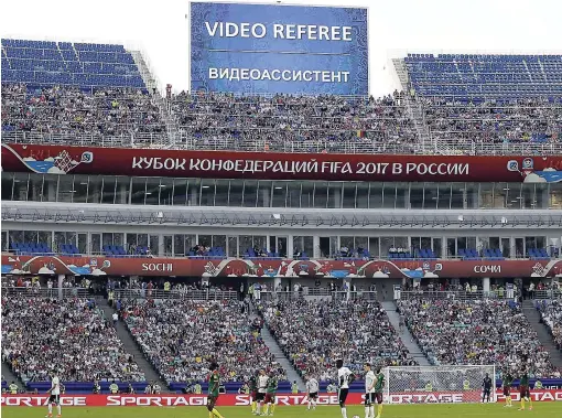  ?? FILE ?? A screen reports that an incident is being investigat­ed by a video assistant referee during the FIFA Confederat­ions Cup Group B match between Germany and Cameroon at the Fisht Stadium in Sochi, Russia on June 25, 2017.