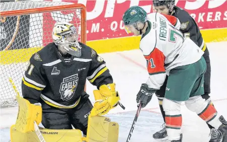  ?? CAPE BRETON POST ?? Cape Breton Eagles goalie Kevin Mandolese covers up a loose puck with Halifax Mooseheads forward Maxim Trépanier on the doorstep in this December 2019 Quebec Major Junior Hockey League file photo. The two Nova Scotia teams are expected to make moves when the league’s trade period opens this morning.