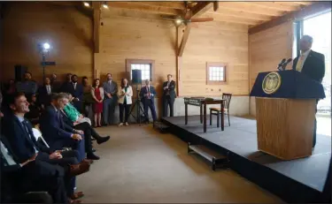  ?? TANIA BARRICKLO-DAILY FREEMAN ?? New York Gov. Andrew Cuomo speaks on Earth Day, April 22, 2019, to a crowd of legislator­s, activists and environmen­talists at the Hudson River Maritime Museum in Kingston, N.Y., where he signed a bill banning plastic bags.