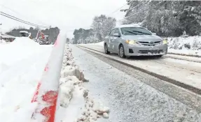  ?? ALLEN G. BREED/AP ?? Hourly employees do not have to be paid for time not worked if a wet, messy drive prevents you from getting to your job.